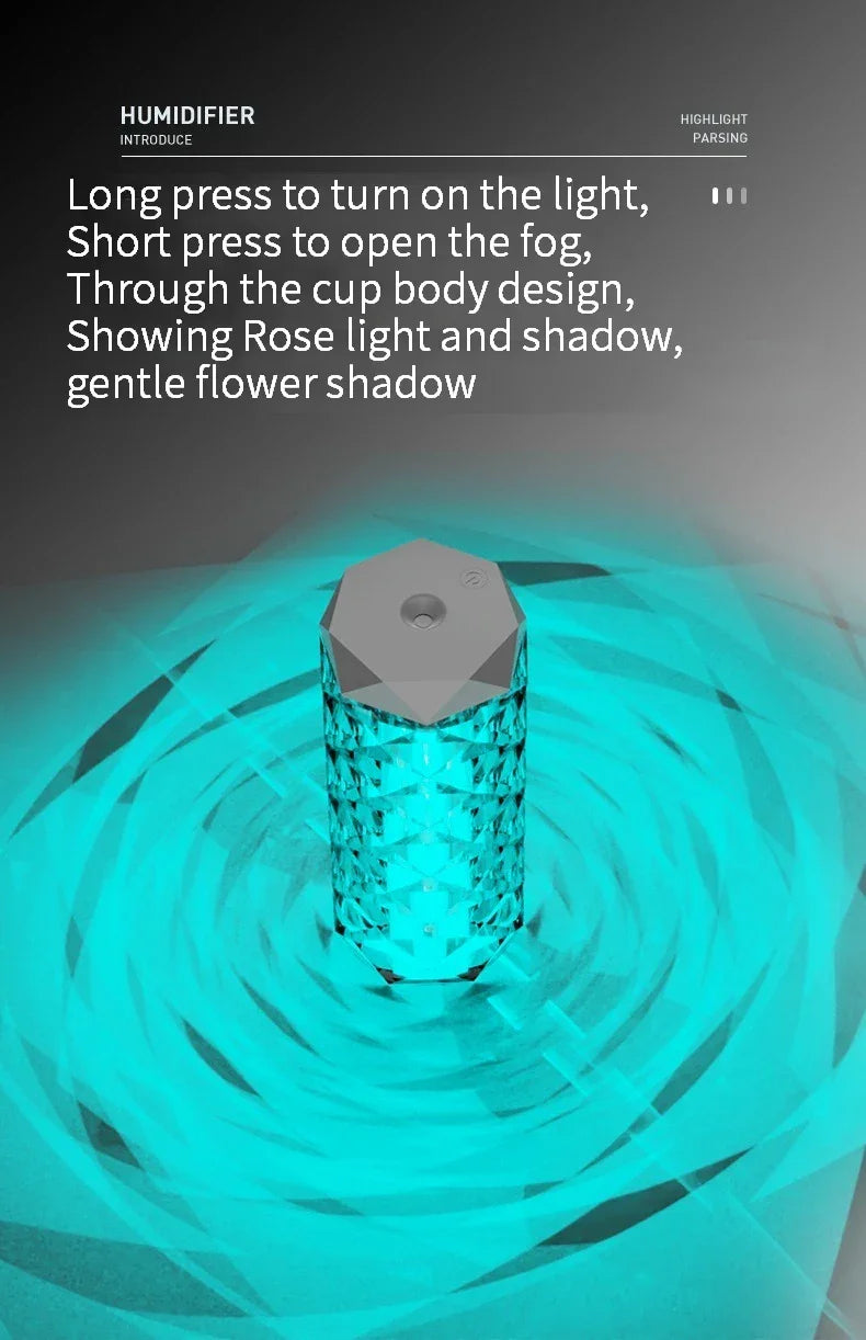 Crystal design LED humidifier emitting blue rose-shaped light pattern on dark background