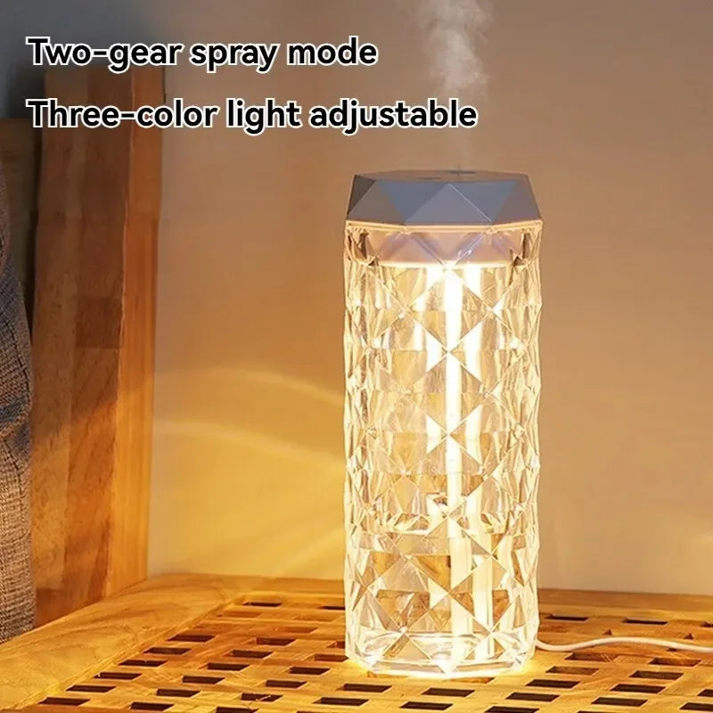 Crystal pattern humidifier with warm LED light, mist spray and adjustable color on wooden table