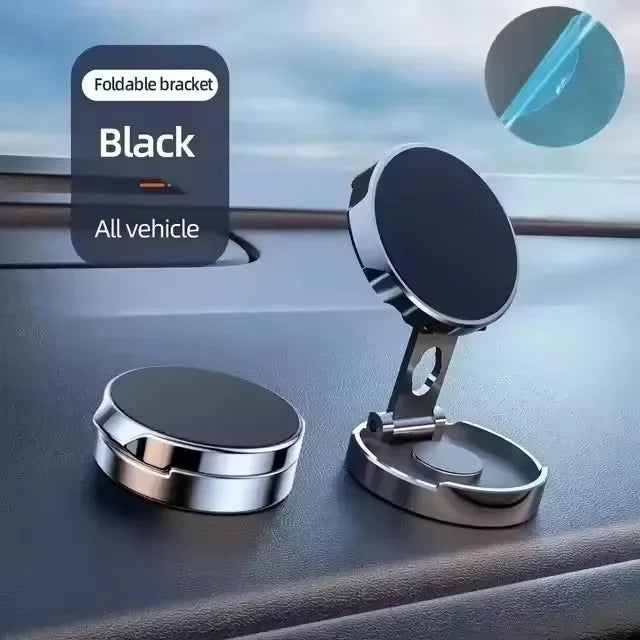 Black foldable magnetic car phone holder bracket on vehicle dashboard.